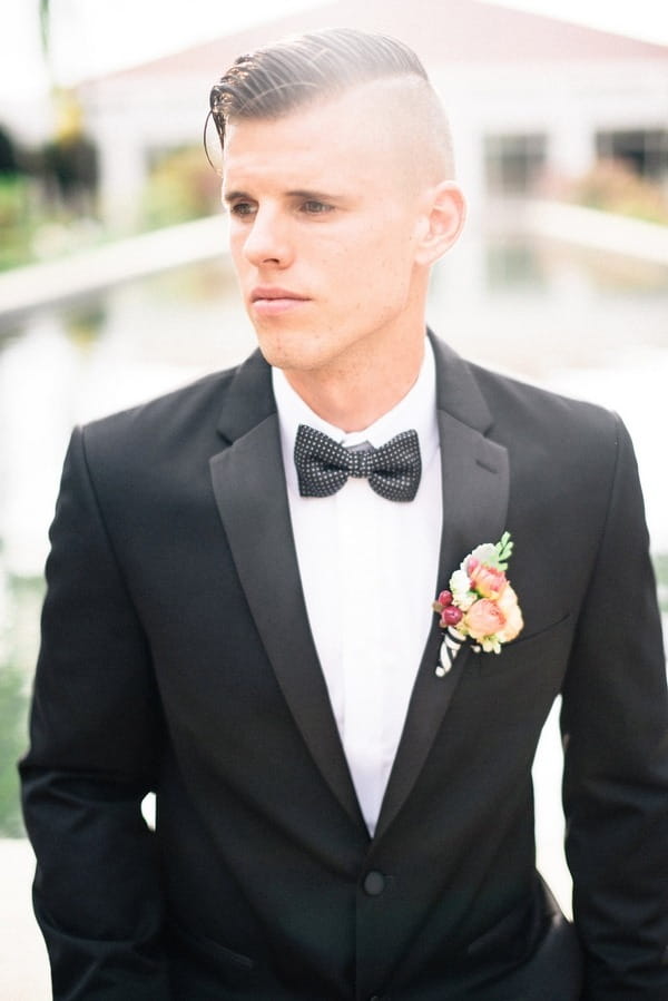 Groom wearing bow tie