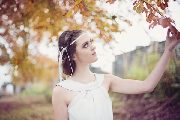 Bride with updo hairstyle with braid