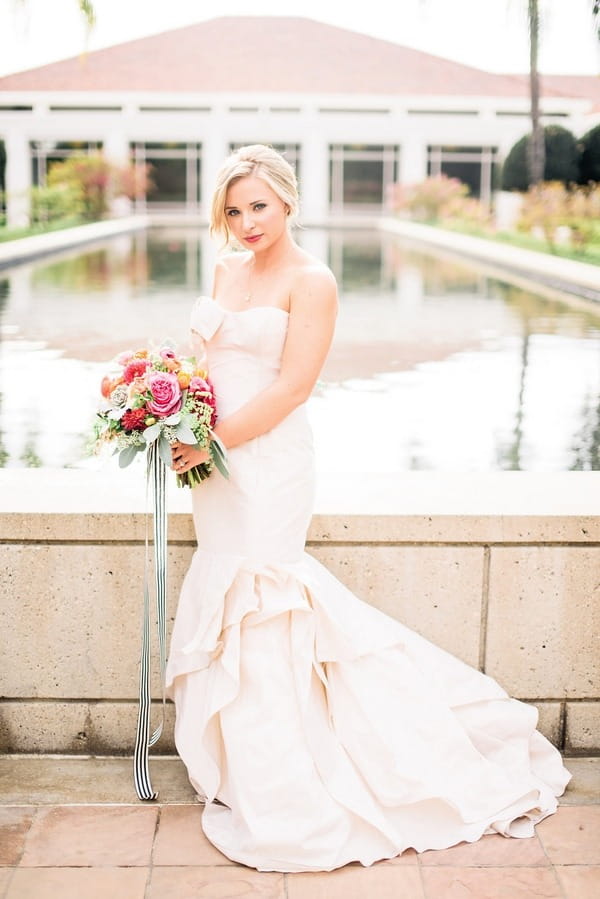 Bride posing with bouquet