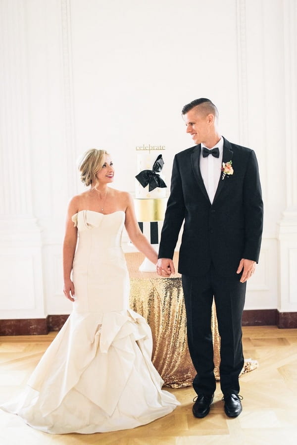 Bride and groom holding hands