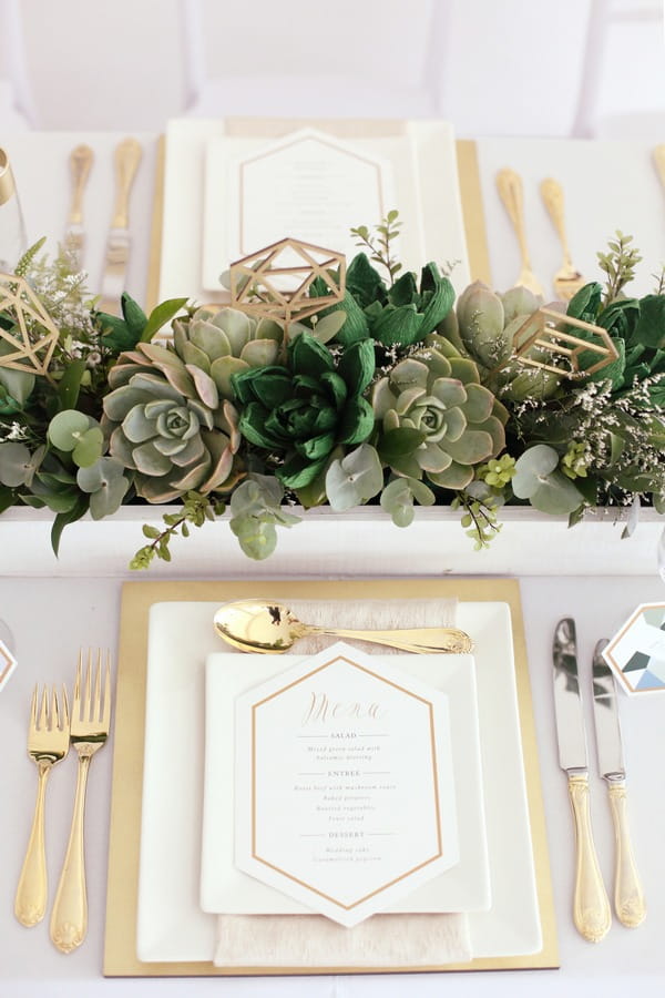 Wedding place setting with succulents centrepiece