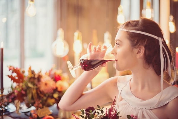 Bride sipping wine