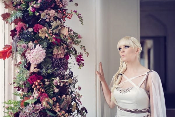 Bride standing by window