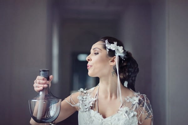 Bride blowing out candle