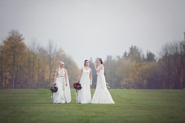 Brides walking in Lowther Castle grounds