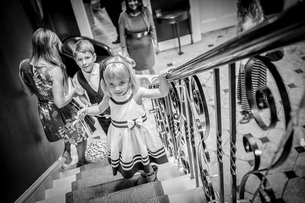 Flower girl walking up stairs