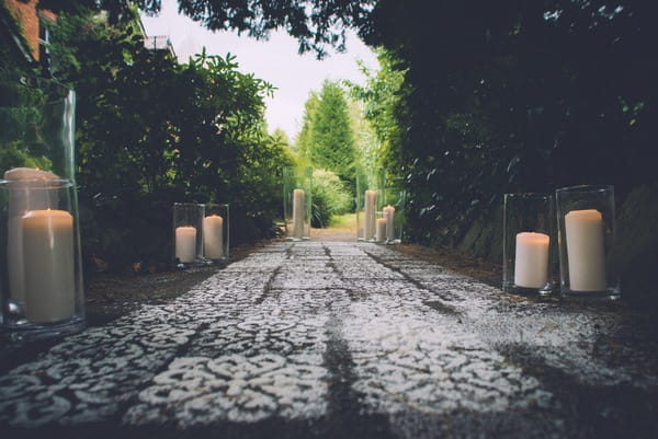 Candlelit patch with white patterns on floor