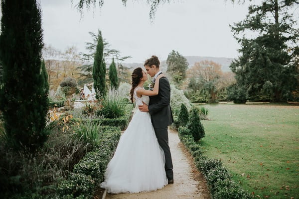 Bride and groom in garden of Deer Park