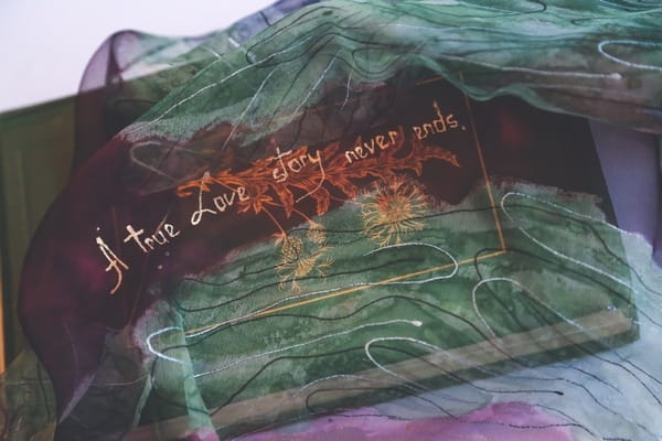 Love story quote under scarf