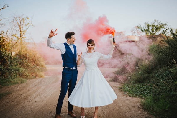 Bride and groom with coloured flare - Picture by Benjamin Stuart Photography