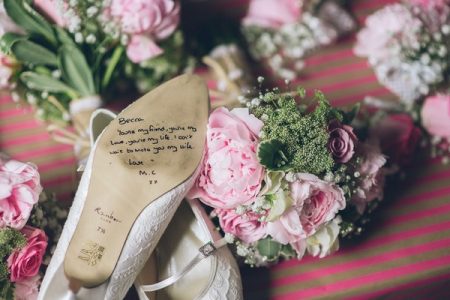Bridal shoe with message from groom written on sole - Picture by Cassie Leedham Photography
