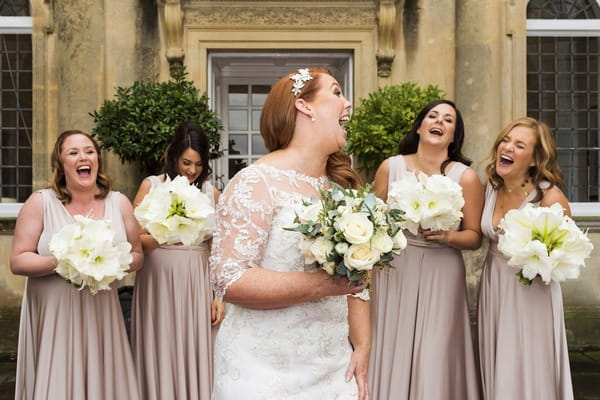 Bride laughing with her bridesmaids - Picture by Nick Church Photography