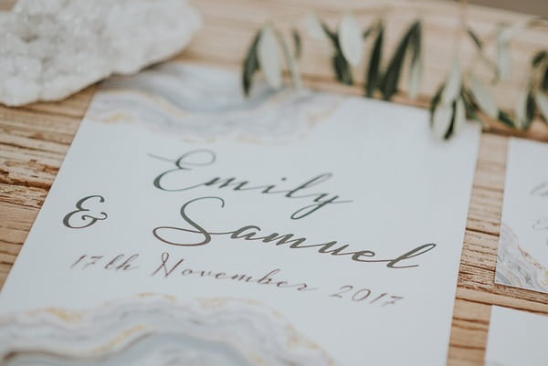 Grey writing on wedding invitation