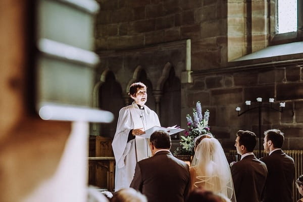 Vicar taking wedding ceremony