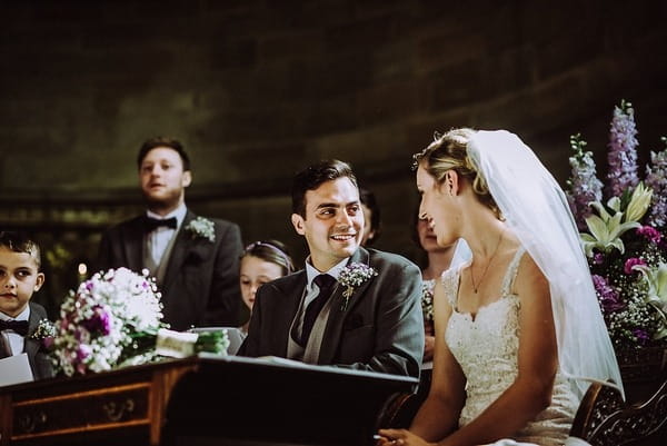 Bride and groom sitting in church