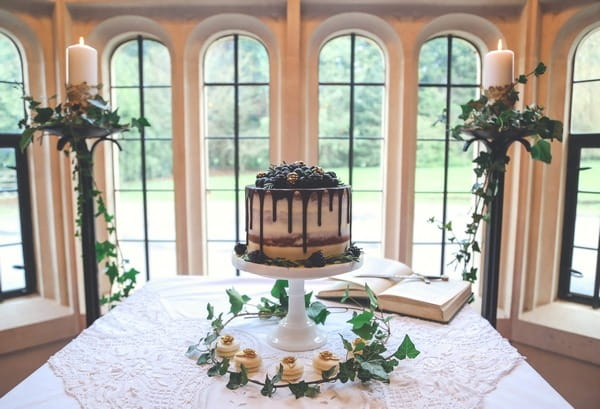 Berry topped wedding cake on table