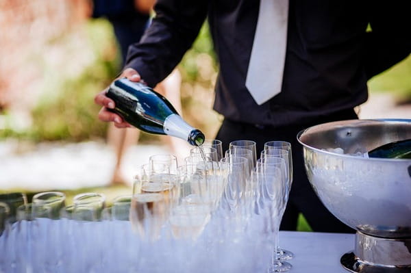 Pouring champagne at wedding