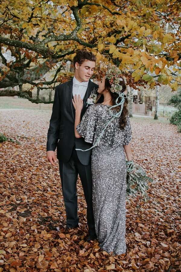 Bride and groom under tree