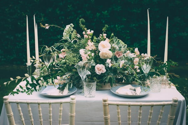 Wedding table with large floral centrepiece