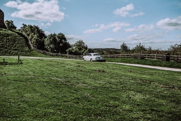 Car driving up driveway towards Tutbury Castle