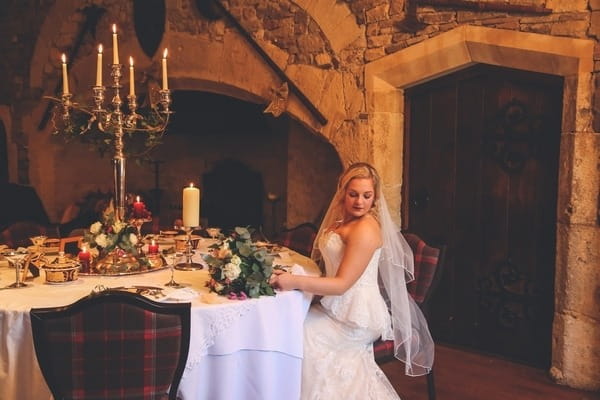 Bride sitting at table