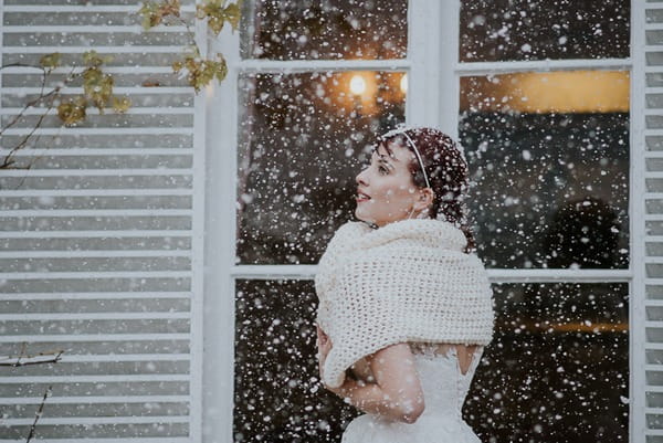 Bride in shrug in snow