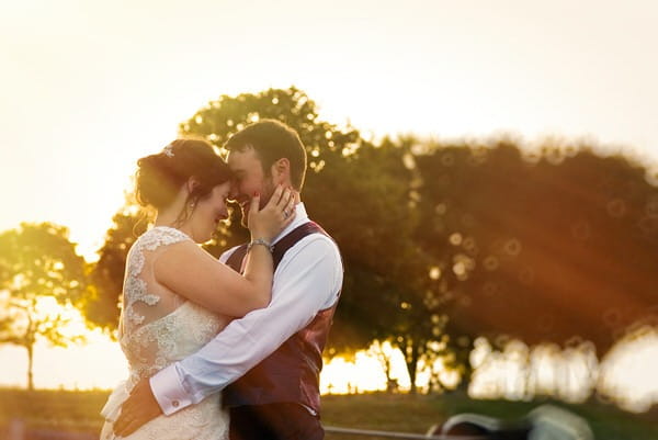 Bride and groom touching heads - Picture by Libra Photographic