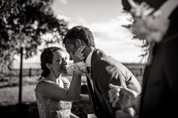 Groom thanking friend for speaking at wedding