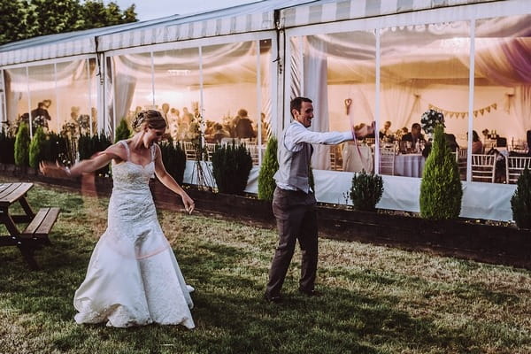 Bride and groom hula hooping