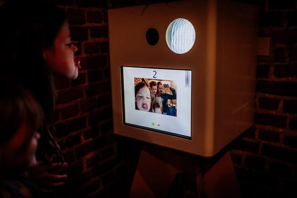 Children using wedding photo booth