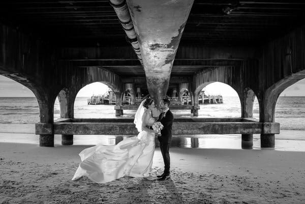 Couple under pier - Picture by Libra Photographic