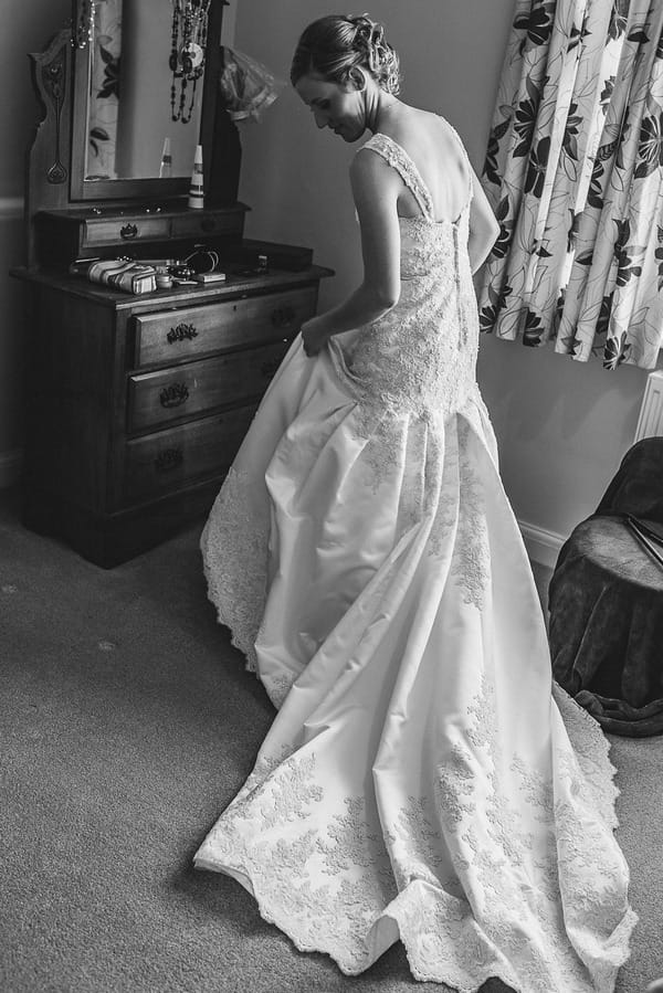 Bride wearing wedding dress with long train