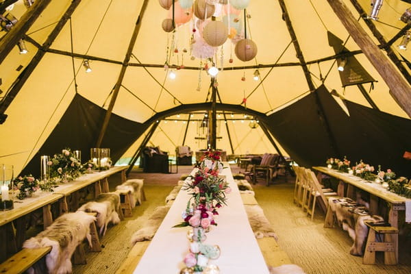 Long benches in wedding tipi