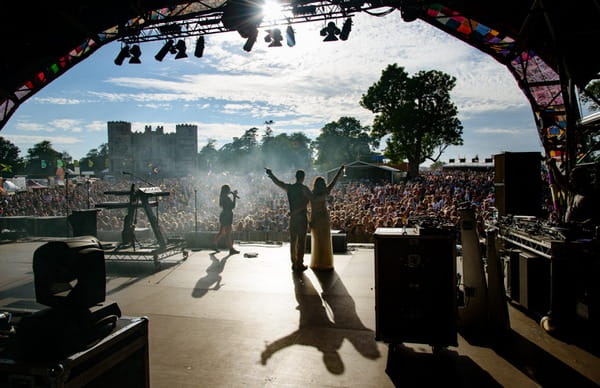 Bride and groom on stage at Camp Bestival - Picture by Libra Photographic