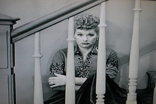 Unhappy woman sitting on stairs