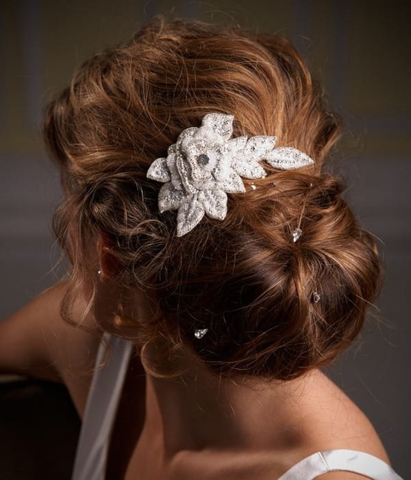 Bride with Chignon Hairstyle with Hair Comb and Hair Pins