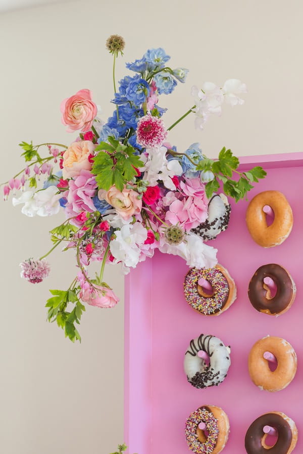 Bright flowers on corner of doughnut wall