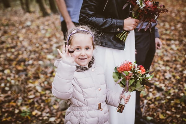 Flower girl holding conker