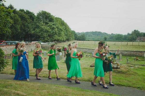 Bridesmaids walking down church path