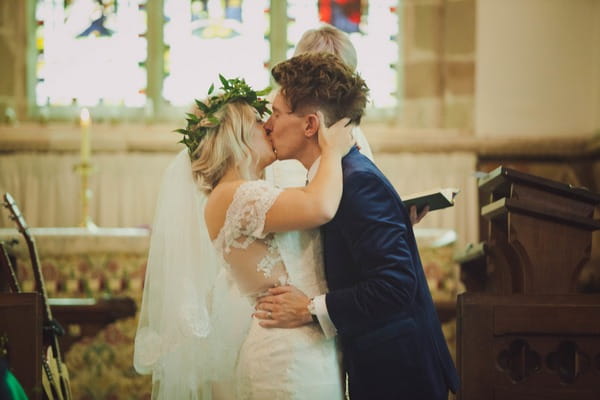 Bride and groom kiss