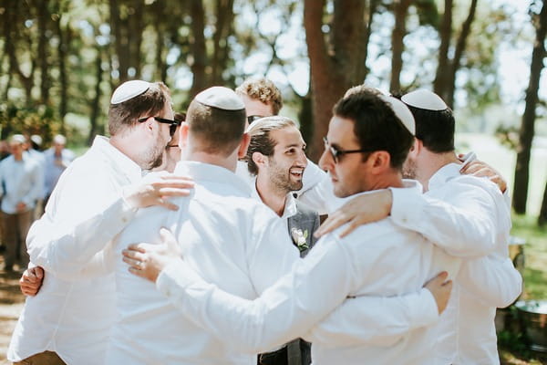 Groomsmen huddle