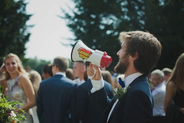 Man using megaphone at wedding