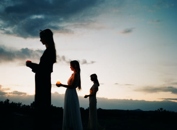 Silhouettes of brides at night