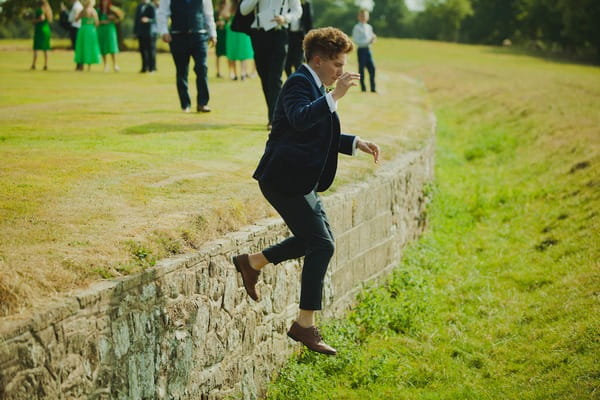 Groom jumping down step