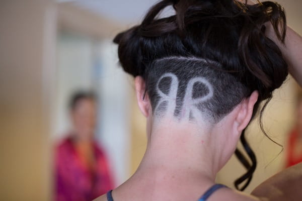 Bride and groom's initials shaved in back of bride's head