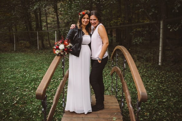 Bride and best friend on bridge