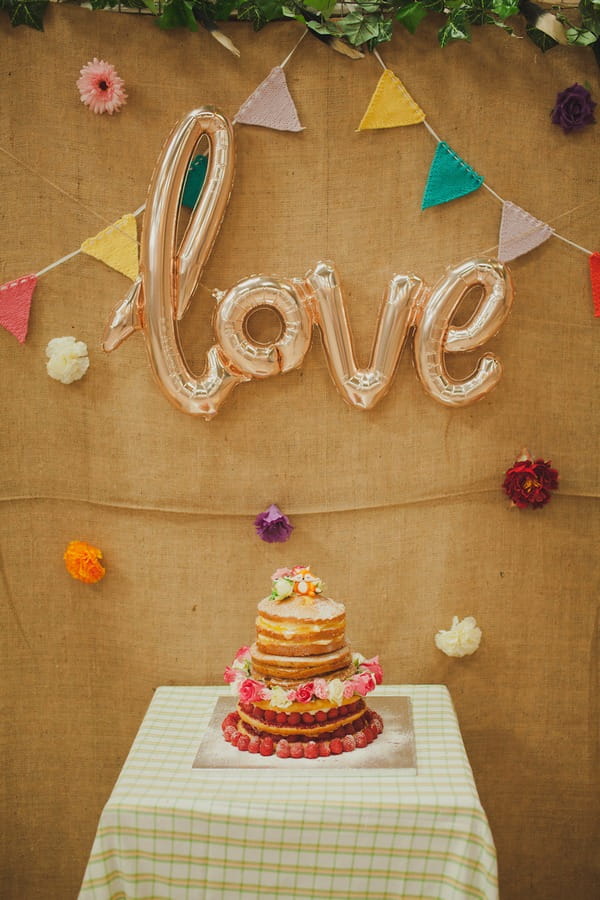 Love sign above wedding cake