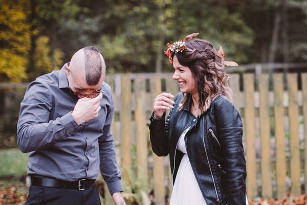 Groom getting leaves away from face