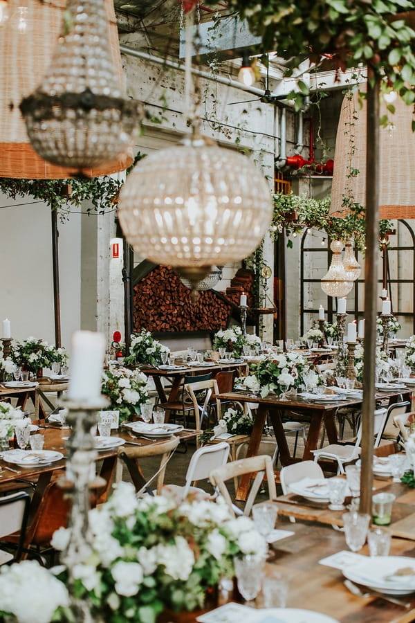 Hanging lights over wedding tables