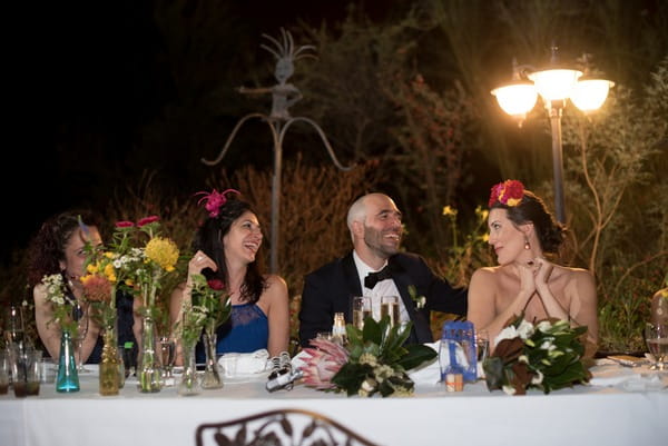 Bride and groom sitting at top table
